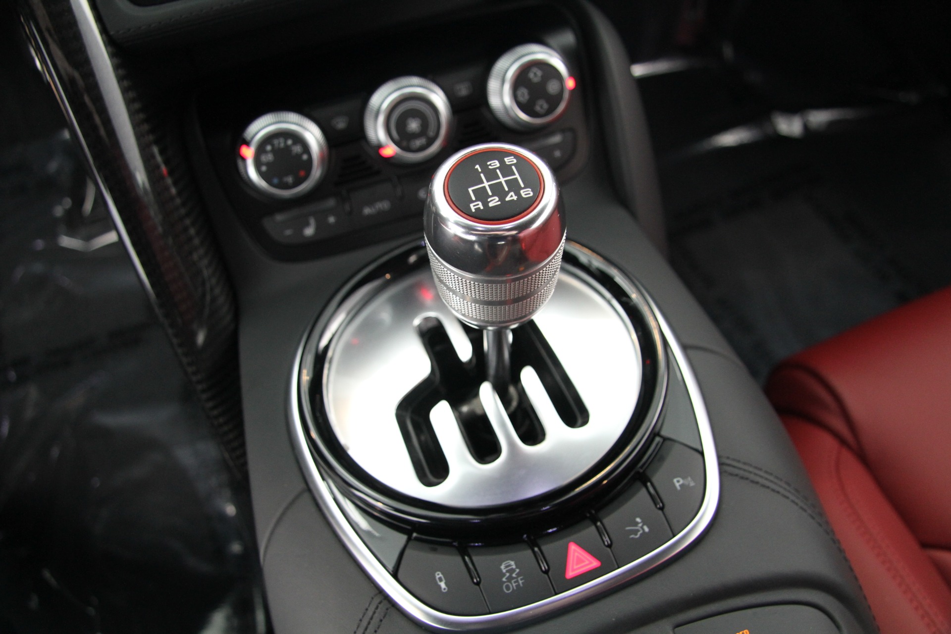 Interior shot of a first-gen Audi R8 showing the exposed gated manual shifter