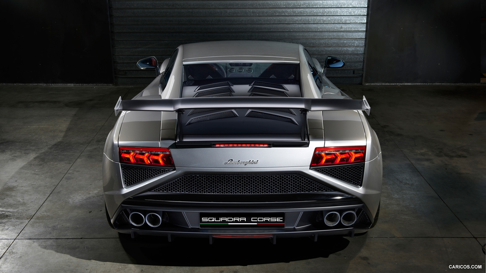 Rear view shot that clearly shows the Gallardo’s exhaust layout and rear bumper styling differences between pre-facelift and facelift